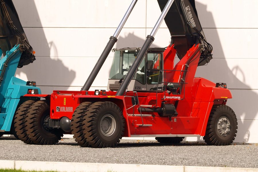 A heavy reach stacker with its boom raised