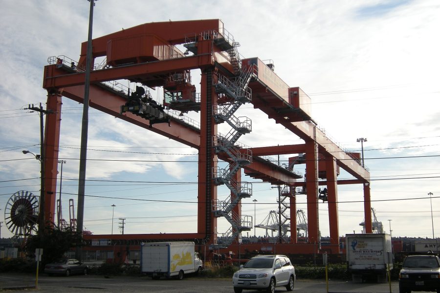 A rail-mounted gantry standing over an intermodal yard