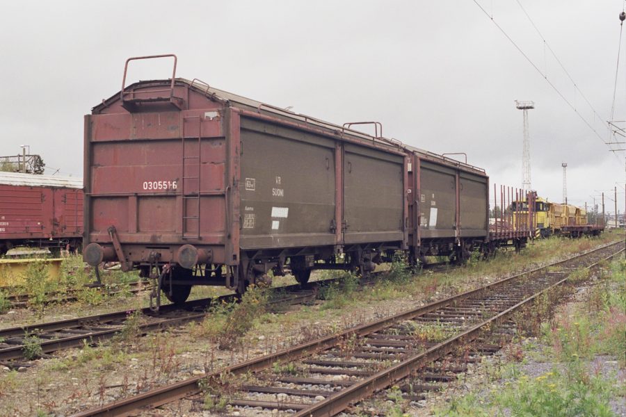 A covered bulk wagon standing in a siding
